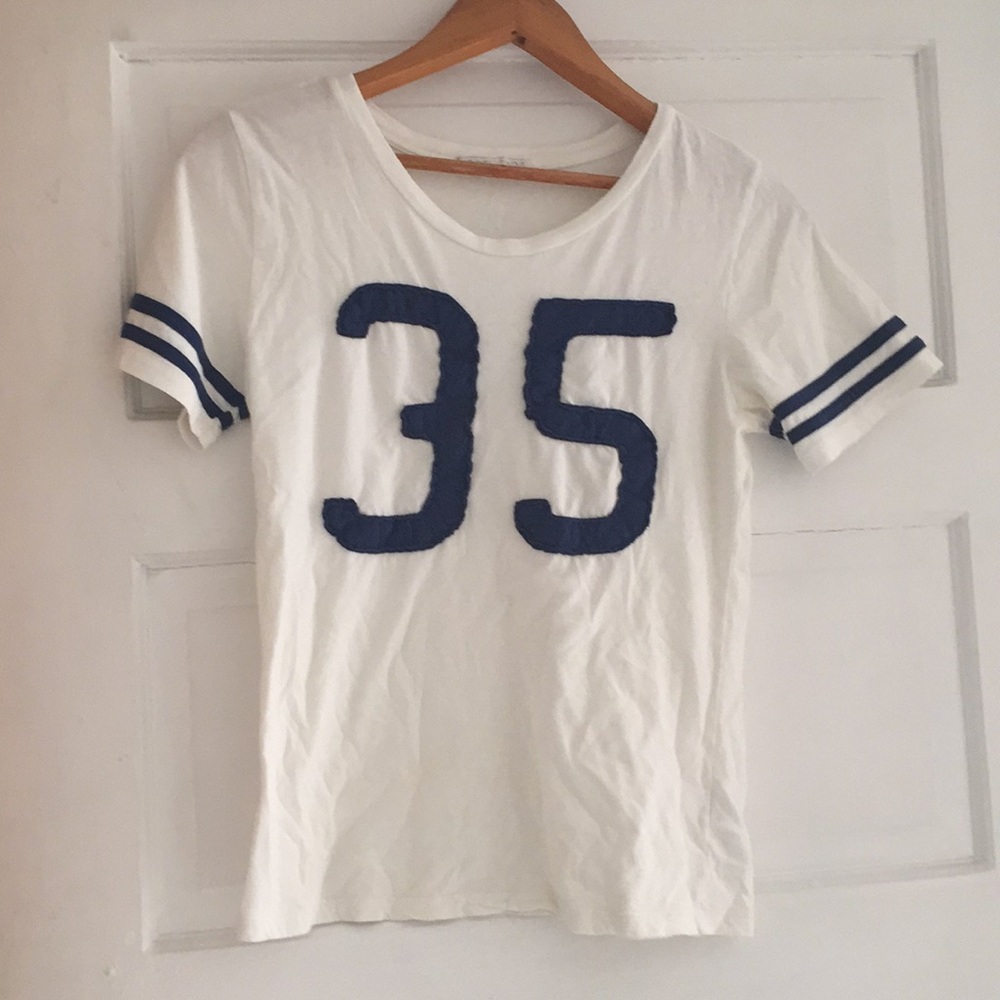 Numbers 35 on it two strips on sleeve